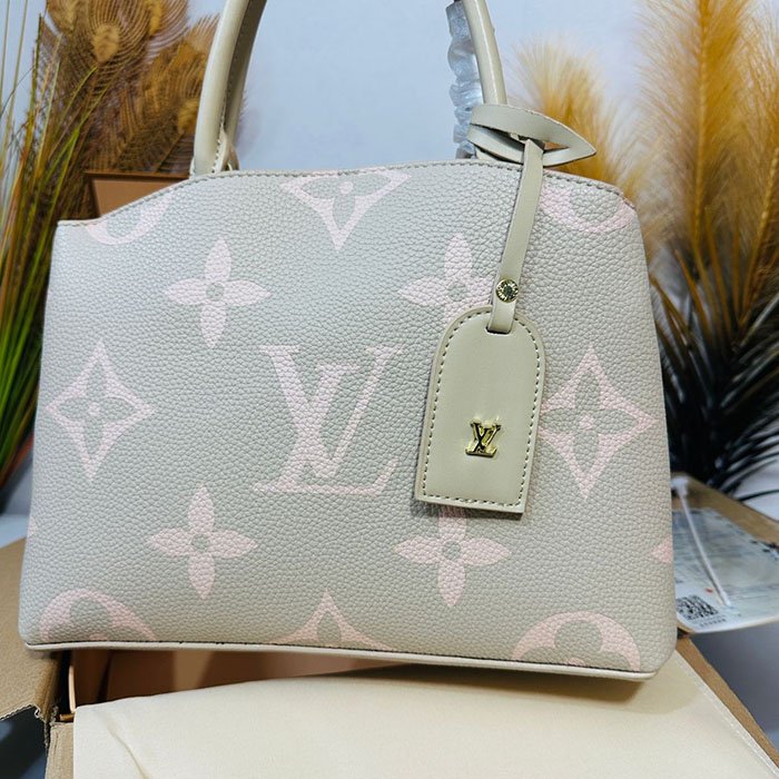 Louis Vuitton Monogram Empreinte Leather Handbag – Soft Beige & Pink